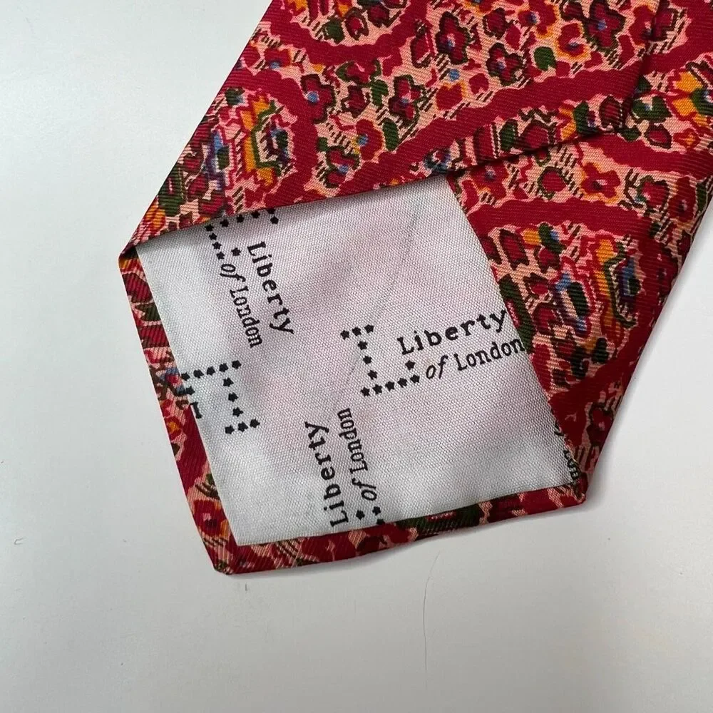 Liberty of London vintage red patterned silk necktie features a vibrant tie